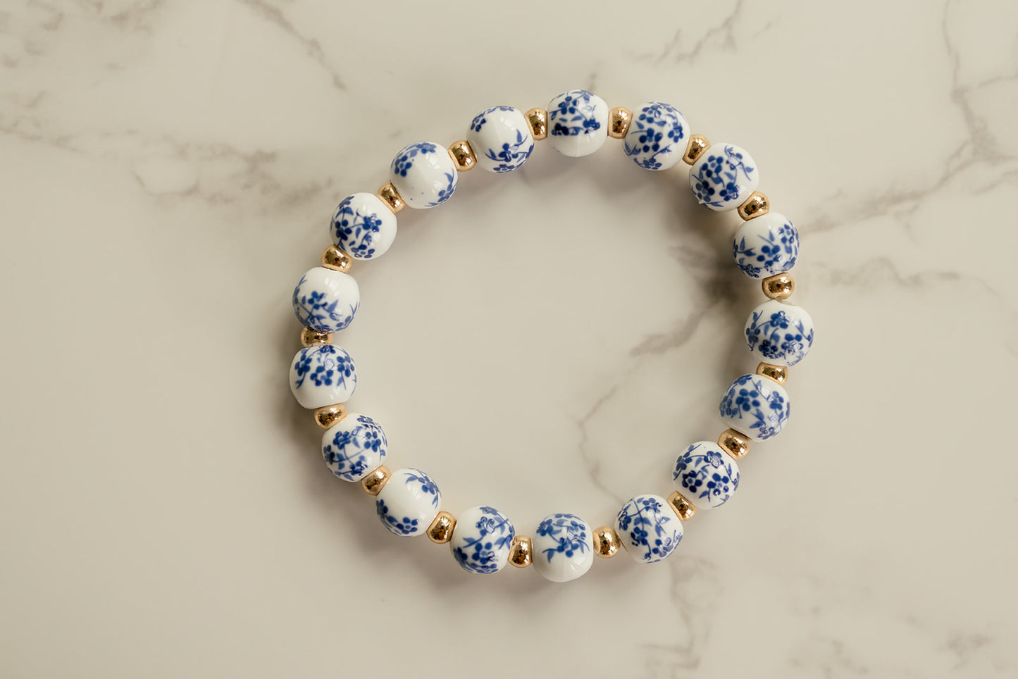 Close-up of the blue and white flowered beads showcasing their intricate design