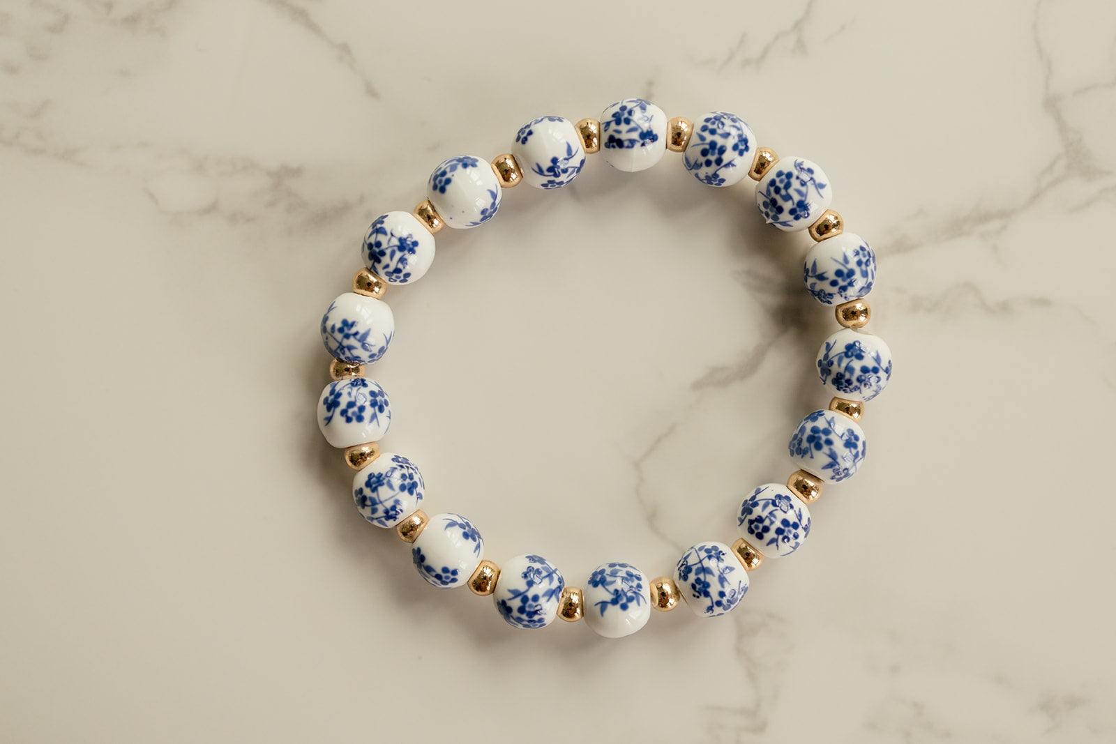 Close-up of the blue and white flowered beads showcasing their intricate design