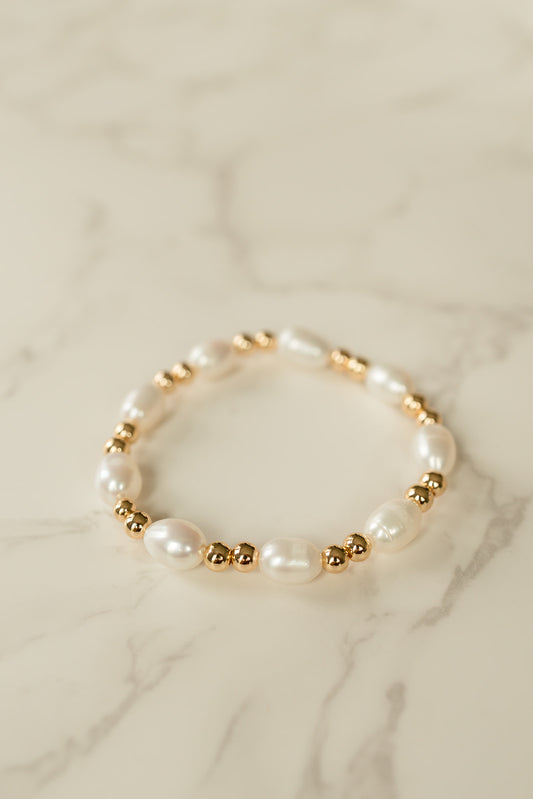 Luxe Pearl Bracelet showcasing lustrous freshwater pearls and gold beads