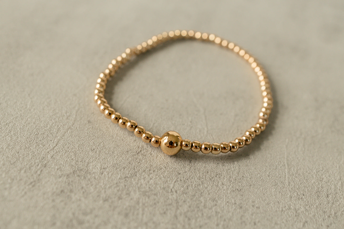 Close-up of the elegant gold beads showcasing their luxurious finish