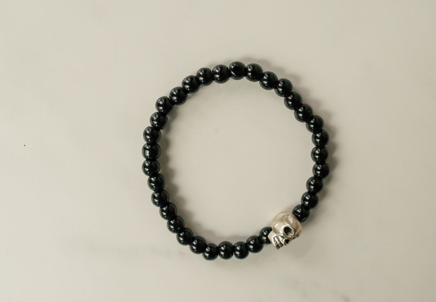 Matte Black Beaded Silver Skull Bracelet